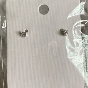 Very small cubic zirconia silver tone earrings.